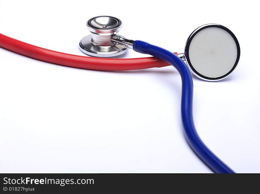 Red and blue stethoscopes isolated in white background