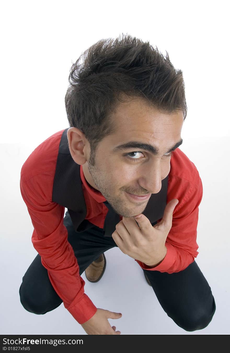 Sitting man looking upward with white background