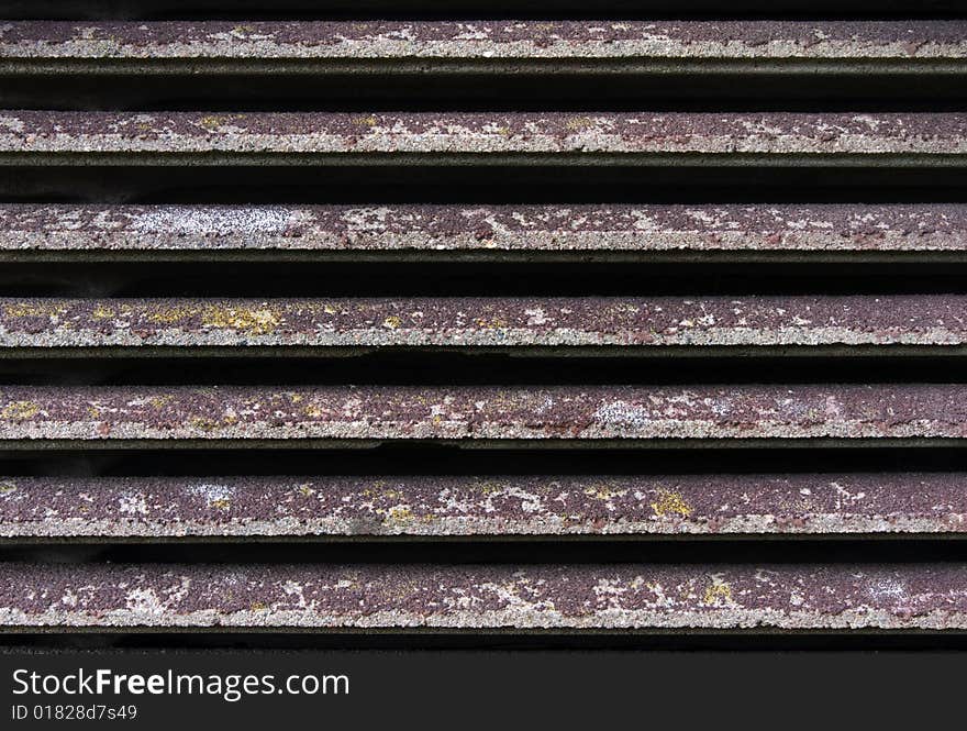 Close-up of stack of old roof tiles.