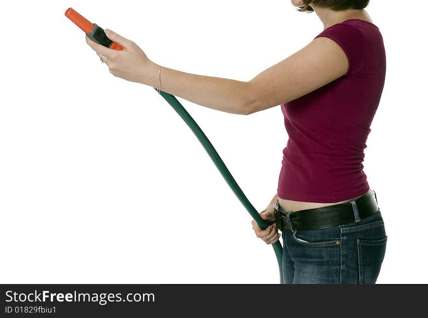 Woman keeps in hands the snake to watering