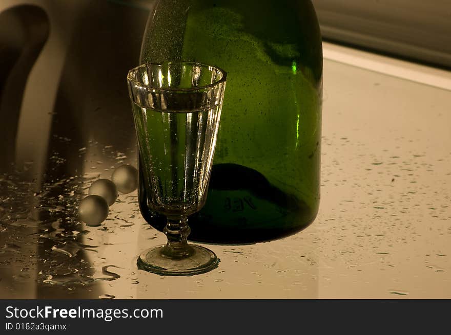 Glass With Champagne And Bottle