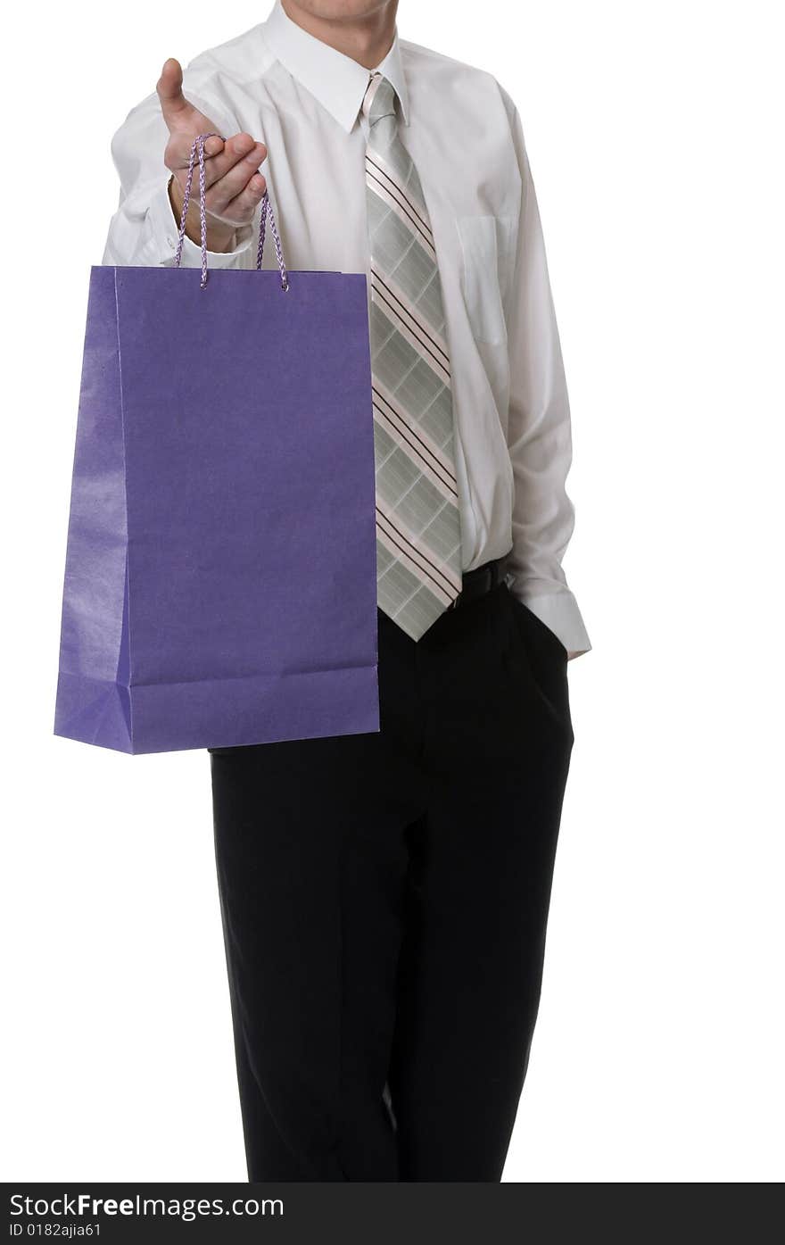 Man keeps in the palm the purple paper bag. Man keeps in the palm the purple paper bag