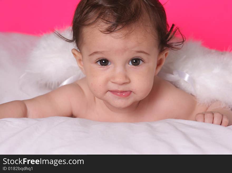 Cute baby girl withangel wings on pink background. Cute baby girl withangel wings on pink background