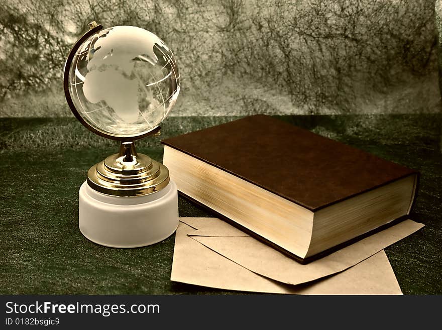 Glass globe and the old book