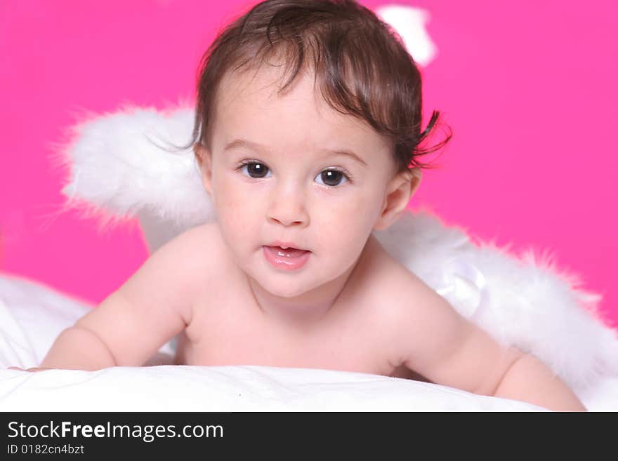 Cute baby girl withangel wings on pink background. Cute baby girl withangel wings on pink background