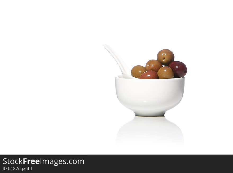 Olives in a cup isolated in white background - studio shot - Olea europaea