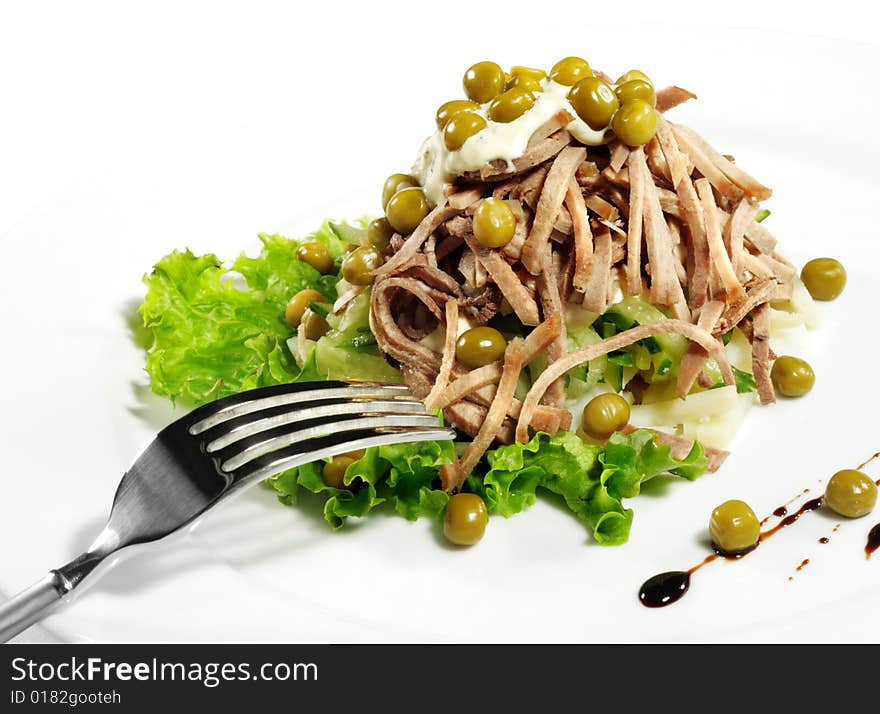 Green Peas and Meat Salad Served with Salad Leaves and Sauce. Isolated on White Background