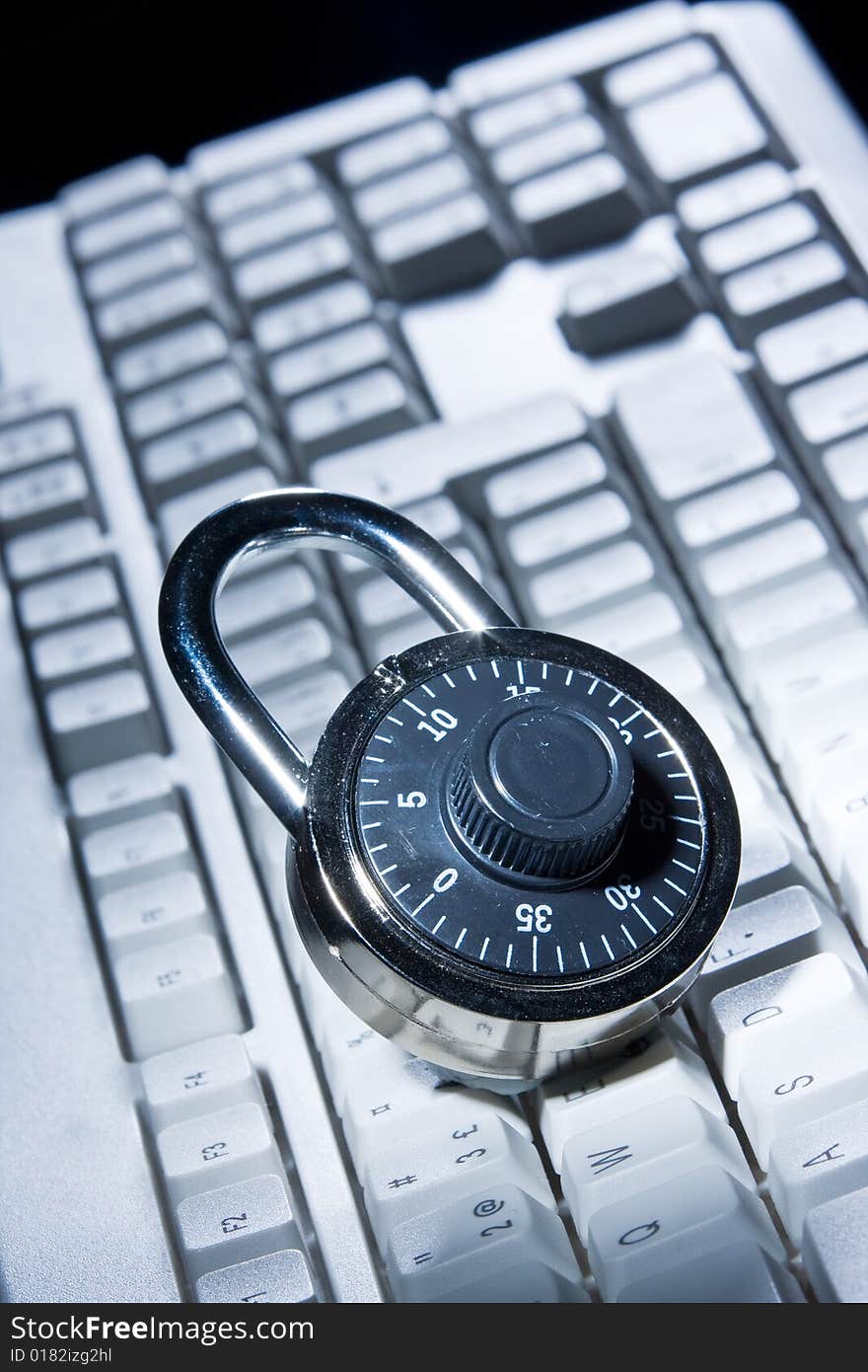 A combination lock on a keyboard. A combination lock on a keyboard