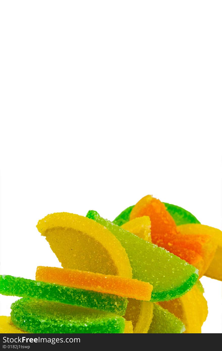 Colorful fruit candies over white background