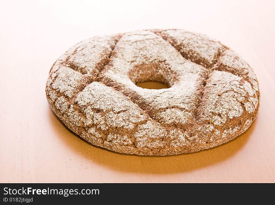 Fresh round rye bread on table