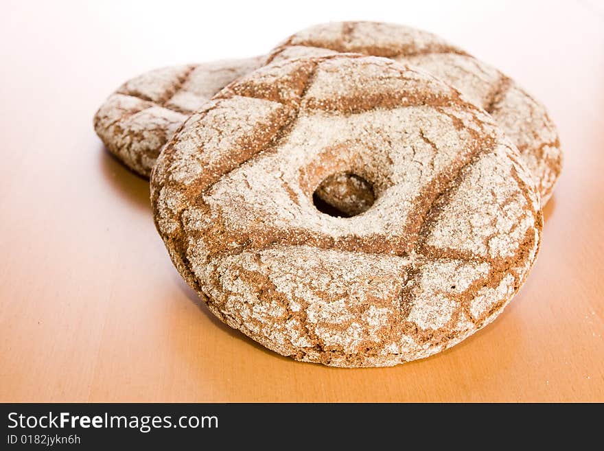 Fresh round rye bread on table