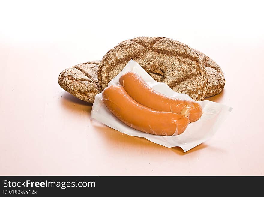 Fresh round bread with sausage. Fresh round bread with sausage