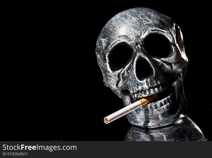 Human skull smoking a cigarette. Human skull smoking a cigarette