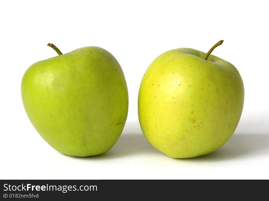 Two green apples isolated over white