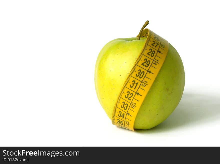 Green Apple with tape metre isolated over white