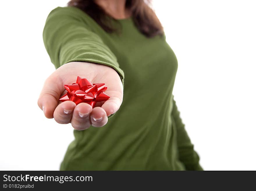 Woman in green shirt holding red ribbon