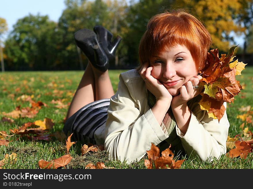 Young Woman In Autumn Park