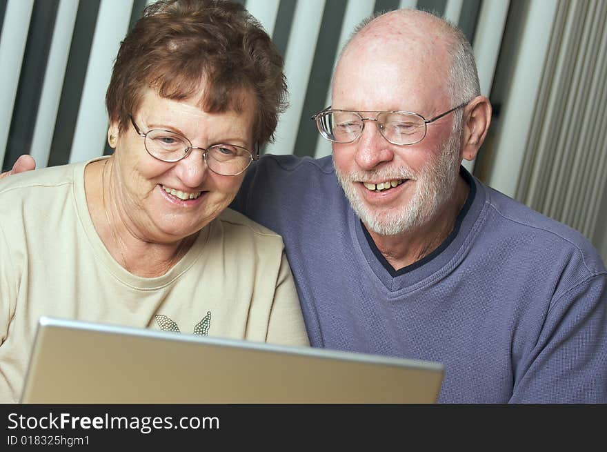 Senior Adults On Laptop Computer