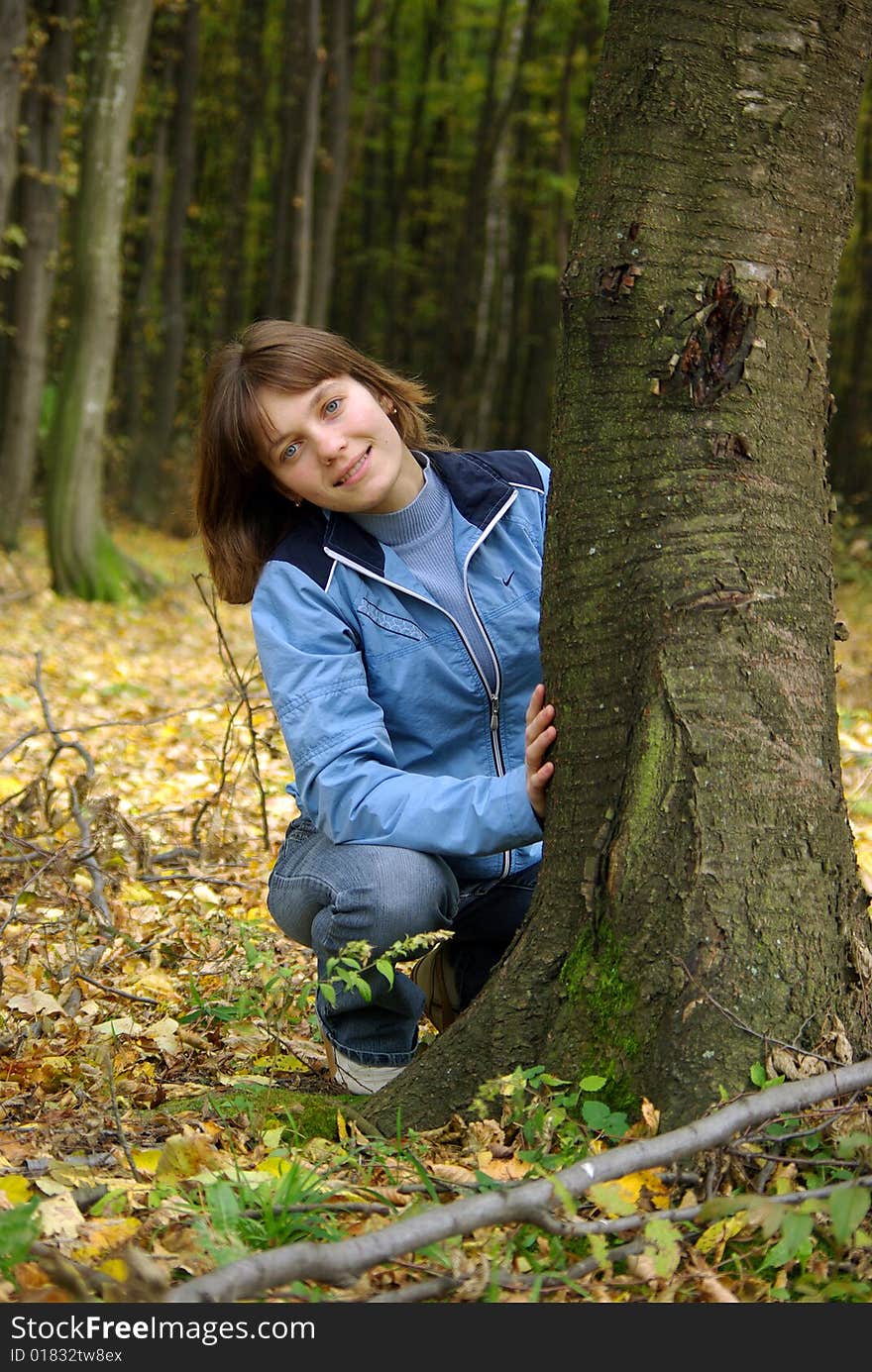 Girl in the forest near the tree. Girl in the forest near the tree.