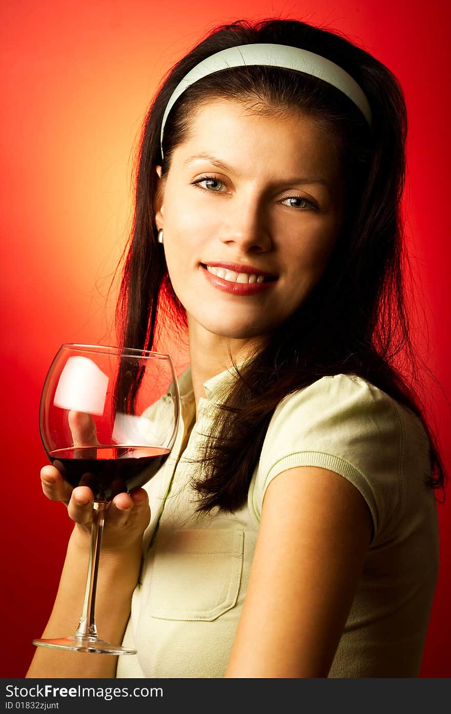 Young pretty caucasian woman with wine over red. Young pretty caucasian woman with wine over red