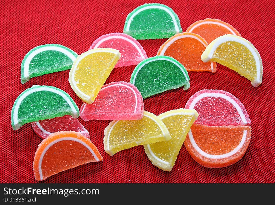 Background fruit Candy on red fabric background. Background fruit Candy on red fabric background.