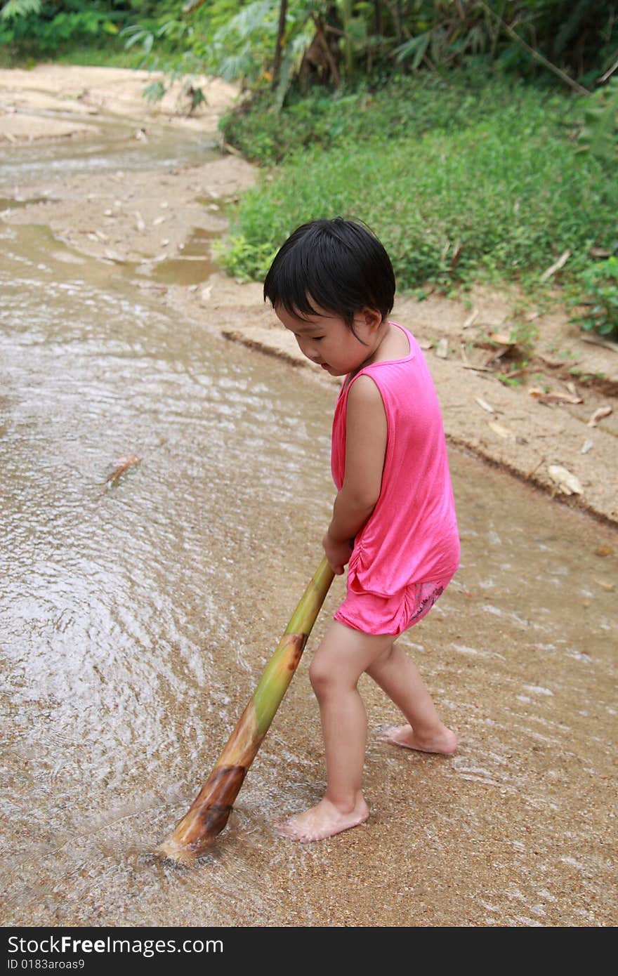 Children playing on the stream