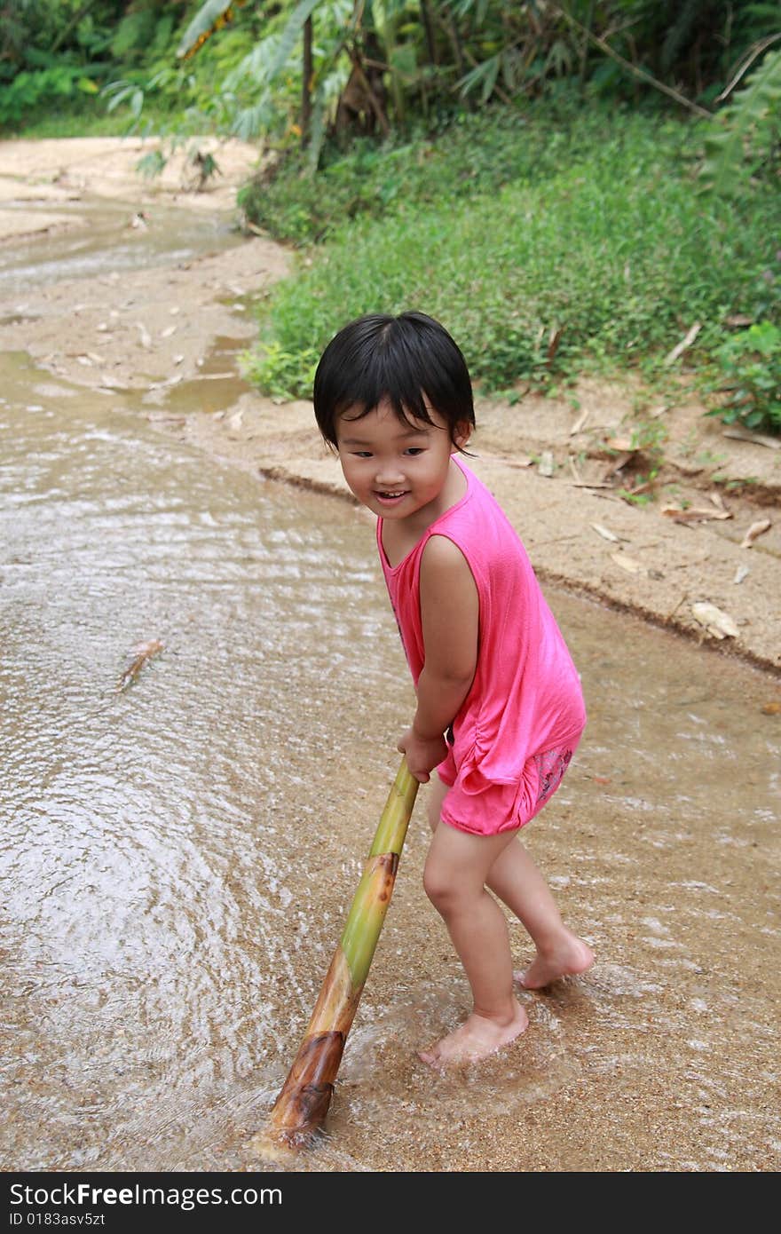 Children playing on the stream