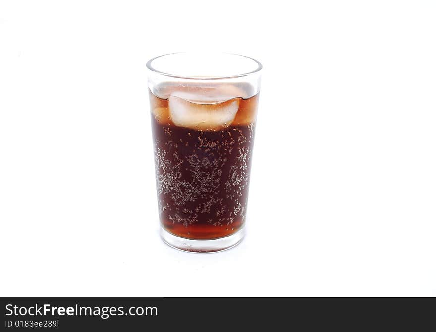 Glass of cold cola fizzy drink with ice and bubbles against a white background. Glass of cold cola fizzy drink with ice and bubbles against a white background