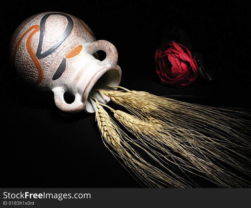 Red rose and wheat with light painting technique. Red rose and wheat with light painting technique