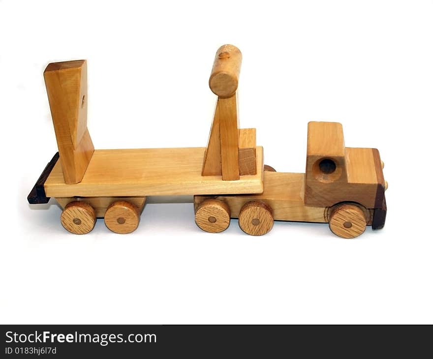 Wooden toy macktruck, side-view on white background. Wooden toy macktruck, side-view on white background