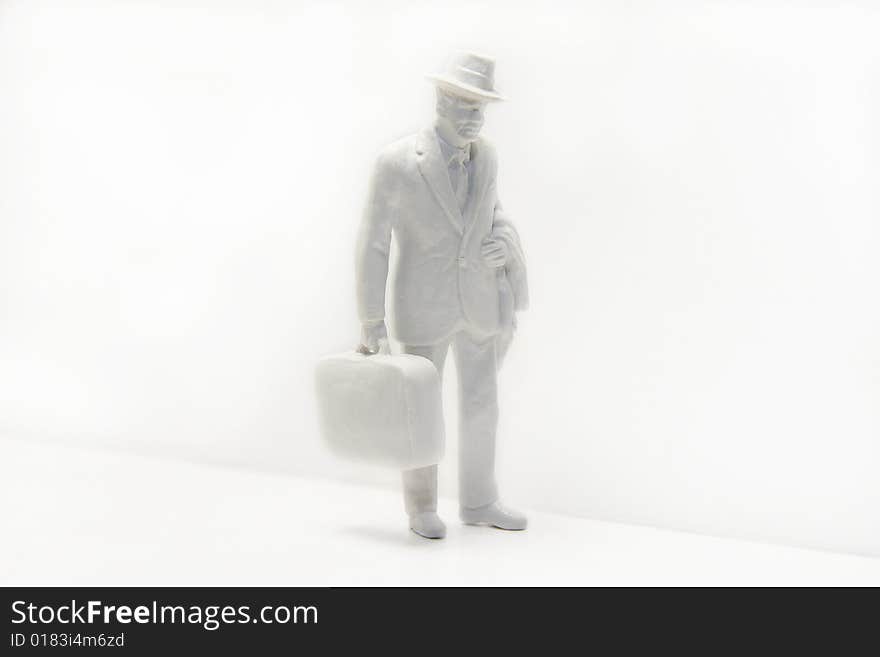 White model, man in suit holding suitcase, on white background. White model, man in suit holding suitcase, on white background