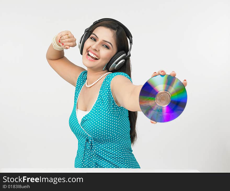 A beautiful asian female grooving to the music