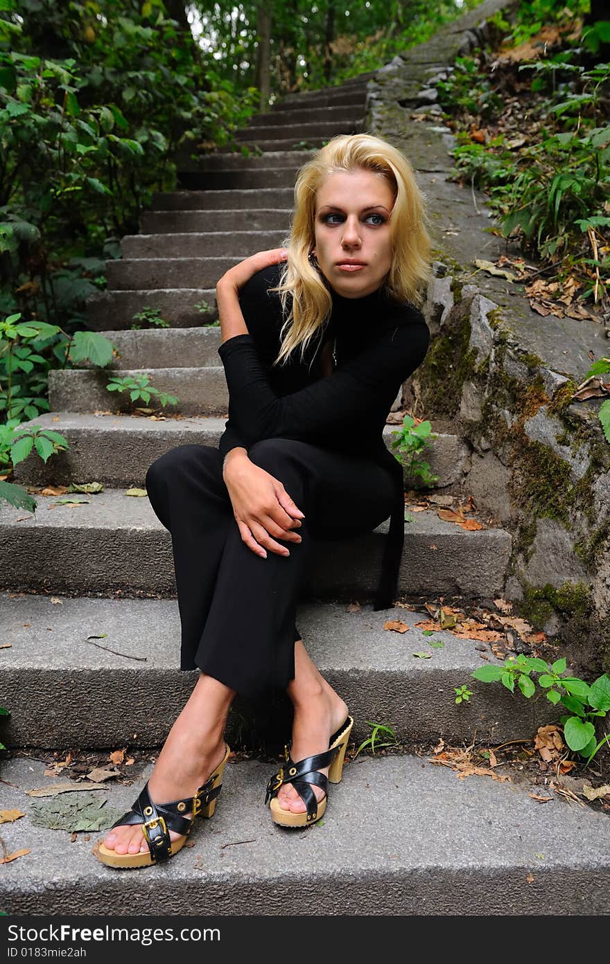 Sad blonde woman in black jersey. Sad blonde woman in black jersey