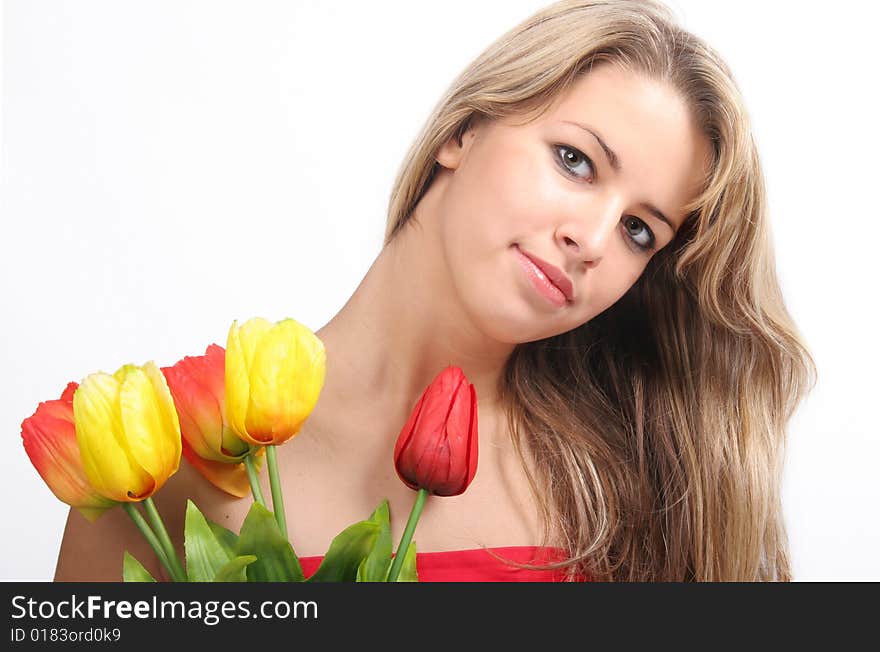 Lovely young girl with  tulips