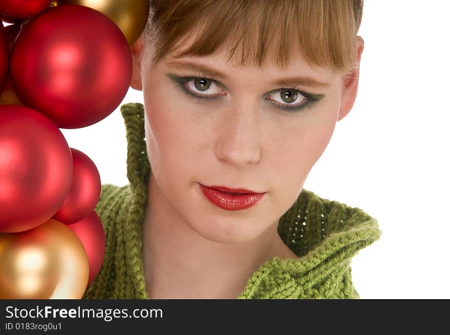 Close-up of young woman with Christmas balls