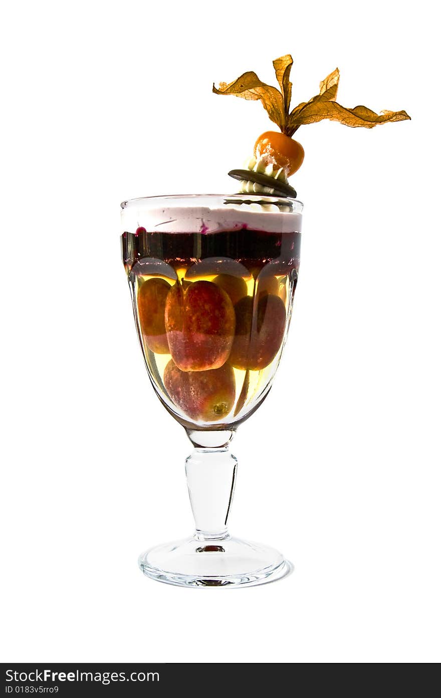 Isolated Jelly dessert with grapes in a glass. Isolated Jelly dessert with grapes in a glass