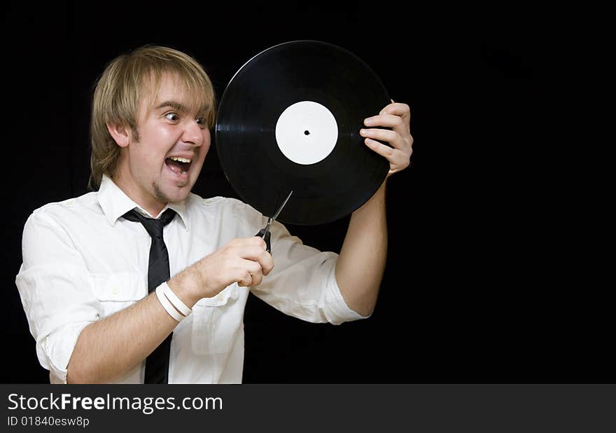 Young man cut vinyl record and screaming