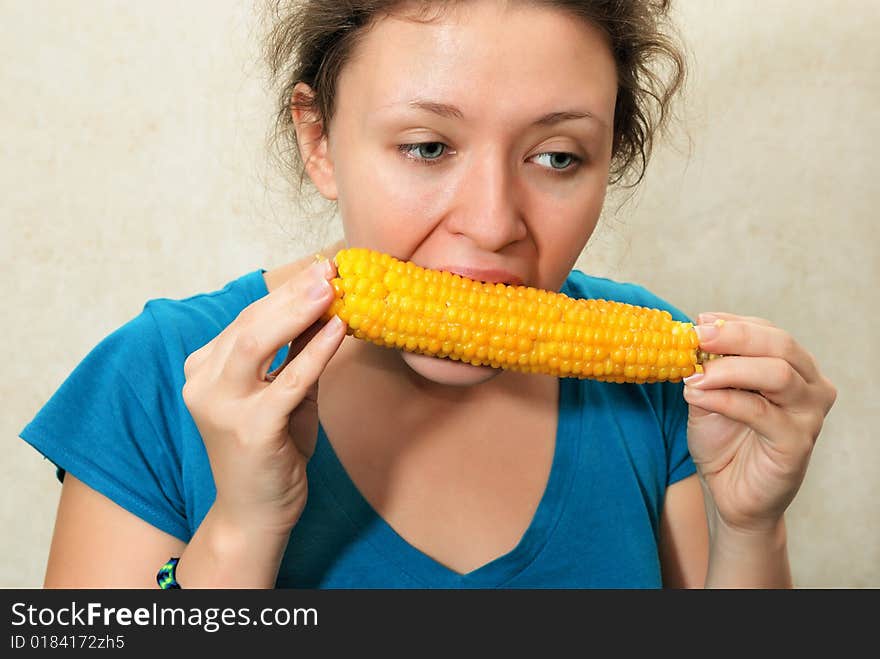 Girl eating corncob