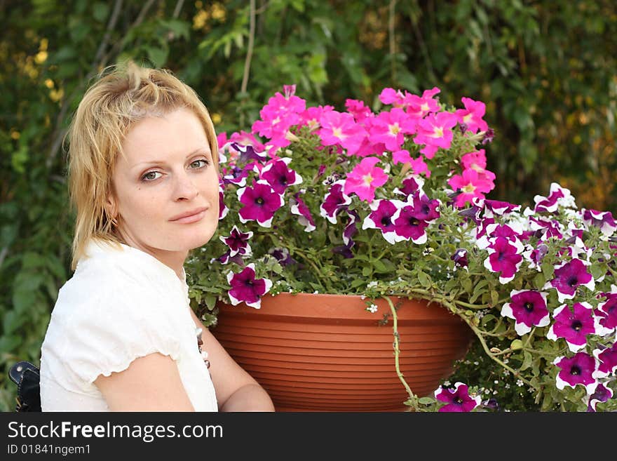 She is the girl with flowers outdoors