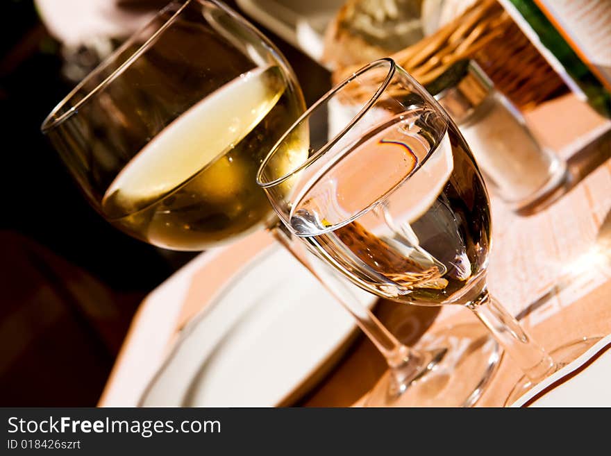 Transparent full glasses on a table outdoors