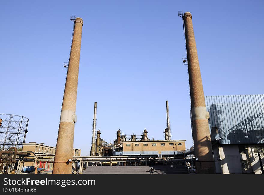 Chemical Factory With Funnels And Iron Tubes