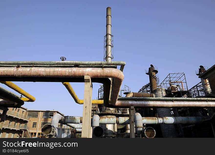 Chemical Factory With Funnels And Iron Tubes