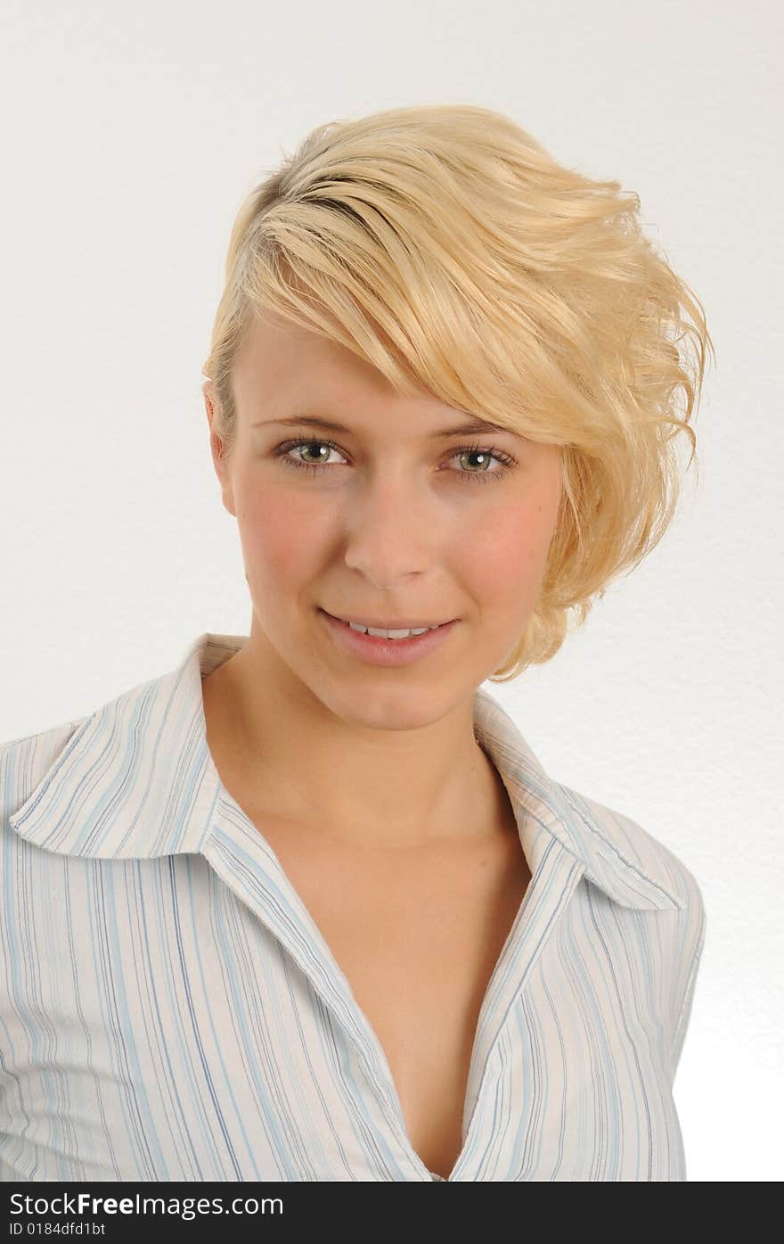 Portrait of a young woman.Wearing a blouse.Isolated over white.