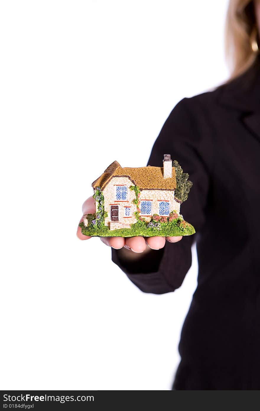 Woman holding house on the white background