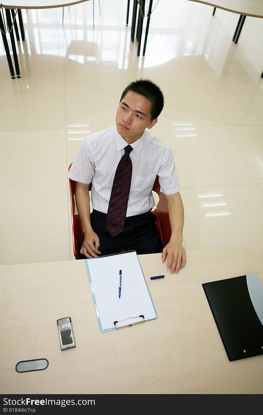 Young asian businessman in office