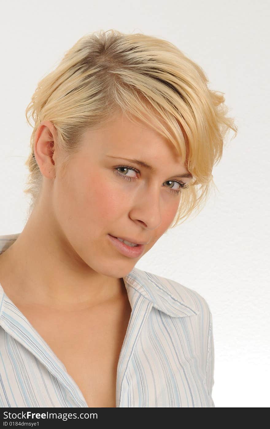 Portrait of a young woman.Wearing a blouse.Isolated over white.