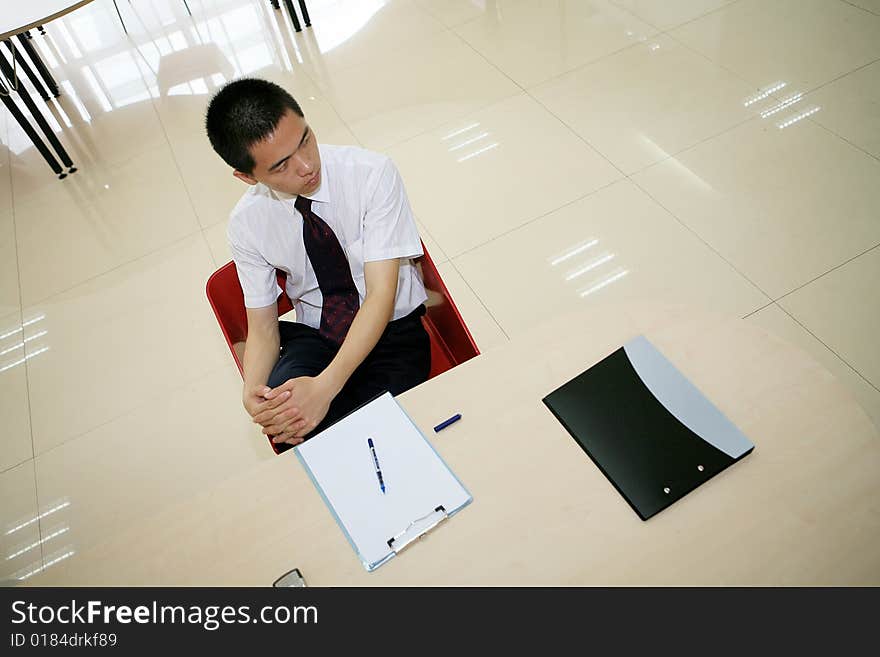 Young asian businessman in office