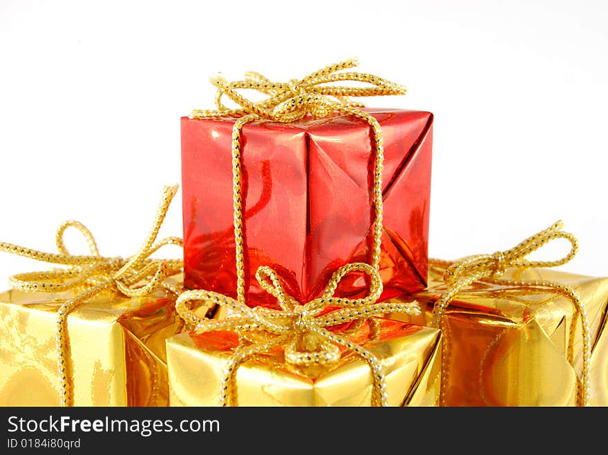 Golden boxes and one red on the white background. Golden boxes and one red on the white background