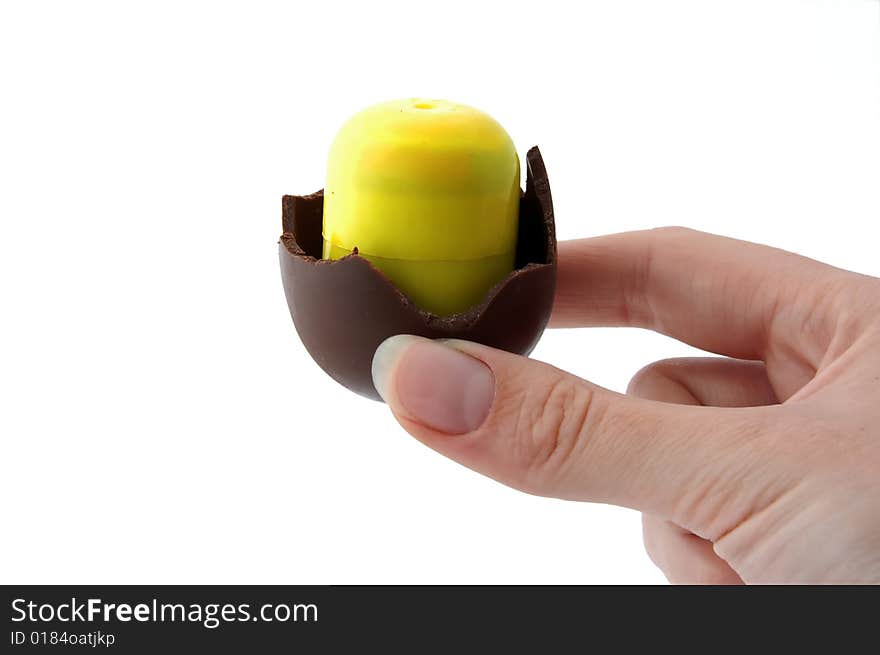 An Isolated to White photo of a mini Easter Egg with toy inside nearly finished. An Isolated to White photo of a mini Easter Egg with toy inside nearly finished