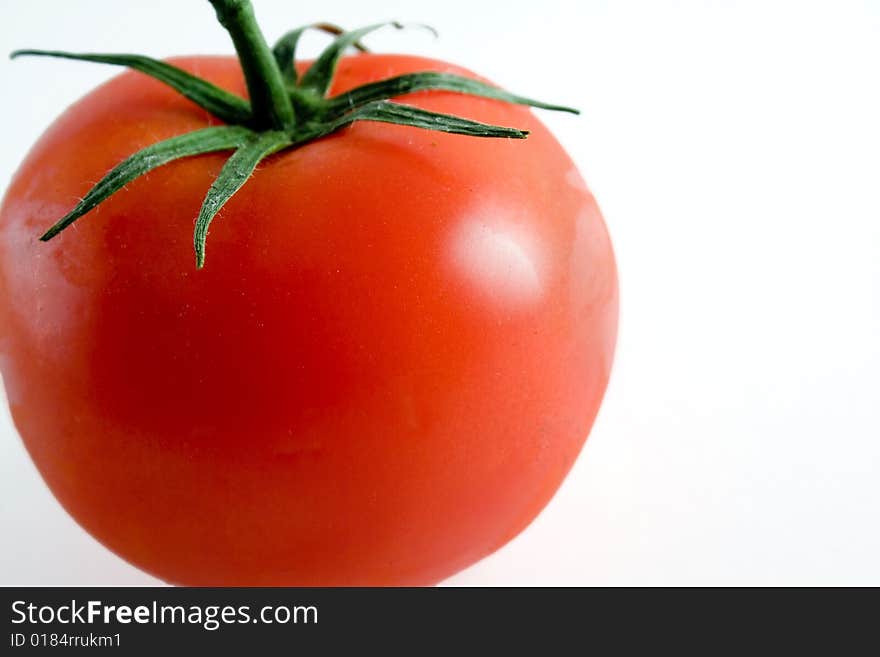 Red ripe tomato on a white background